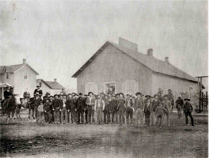 Becker store and home with group of men.
